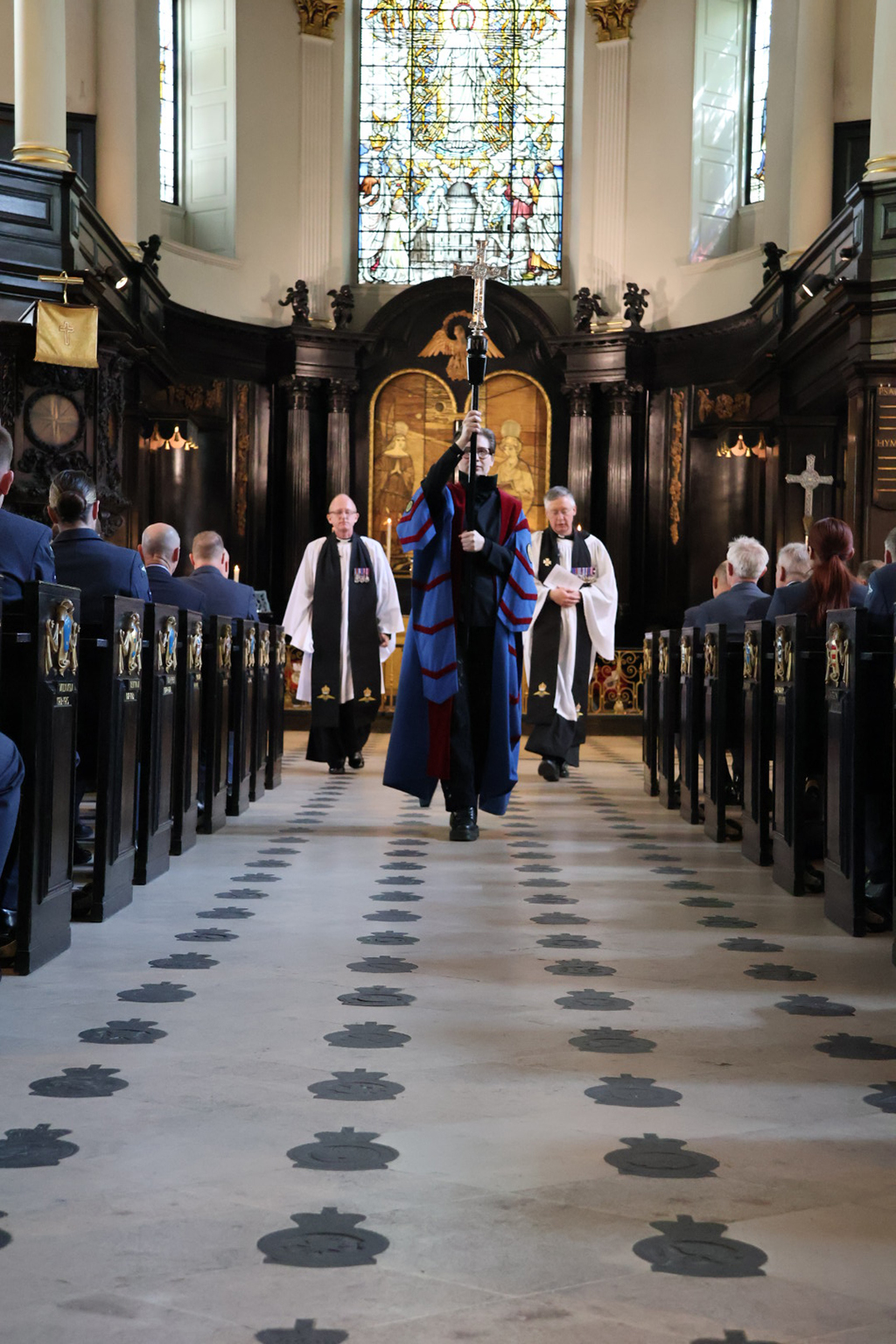 The officiating Clergy process toward the back of the church near the end of the service.